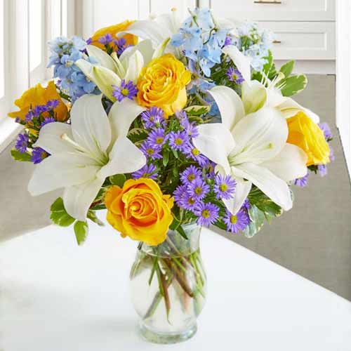 Send White Lilies, Yellow Roses & Delphinium Vase Bouquet For Mother’s Day | Bright N Beautiful Flowers For Mom